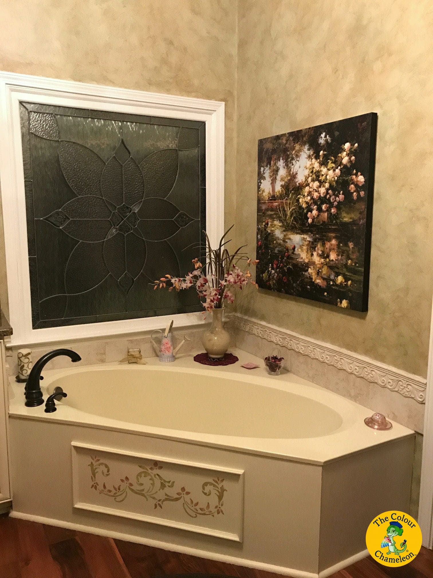 The same bathroom in mottled cream with the tub surround repainted taupe and gold