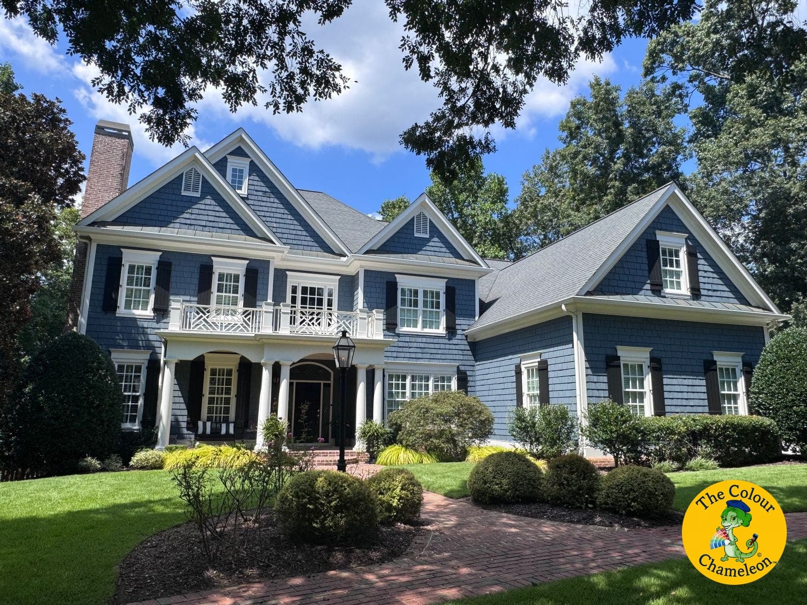 The same colonial in Cape Cod blue siding with white trim and black shutters
